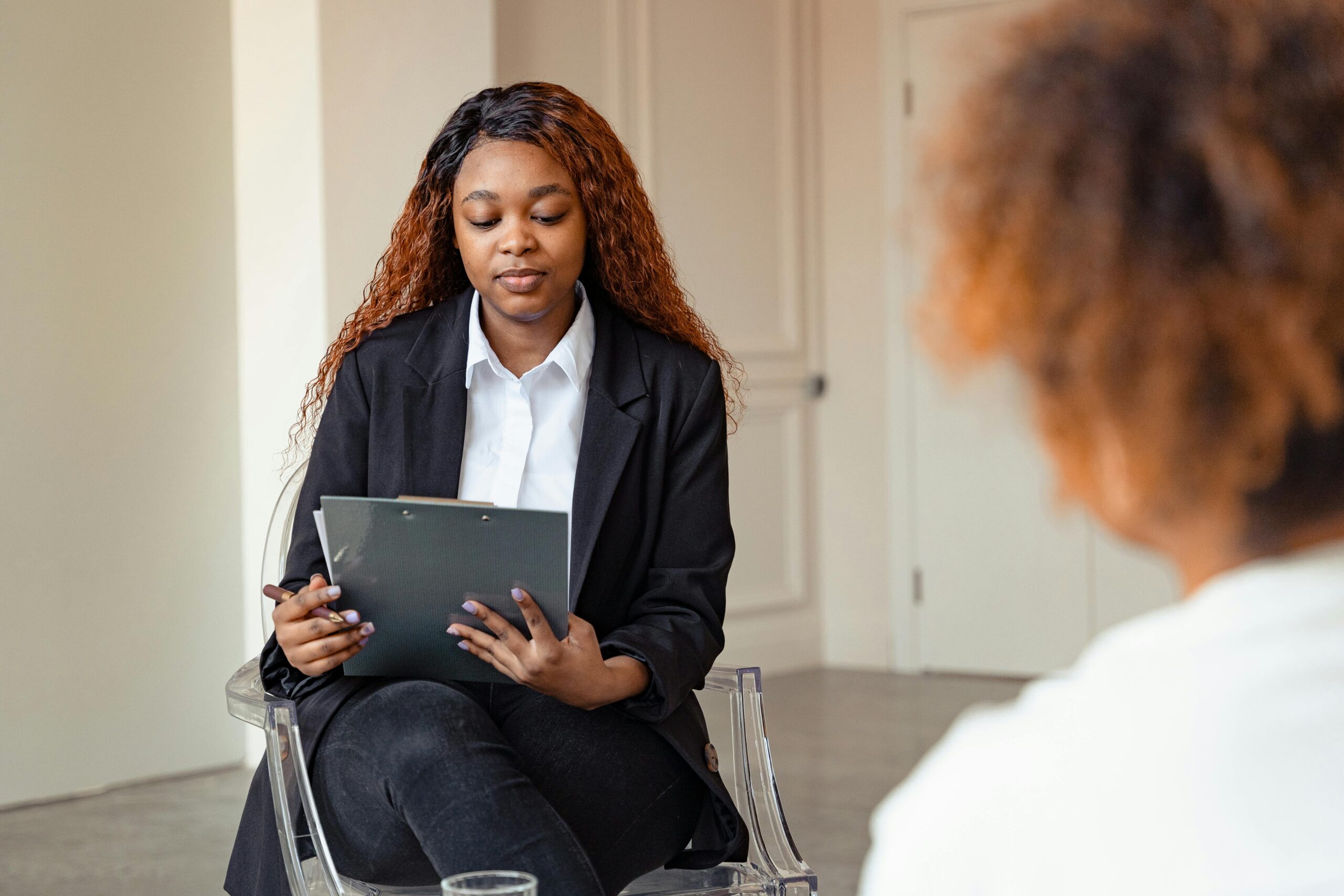 Therapist conducting a session with a client, focusing on mental health care.